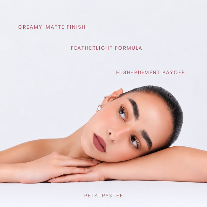 Model wearing Midnight Merlot crayon lipstick: creamy-matte finish, featherlight formula, high-pigment payoff