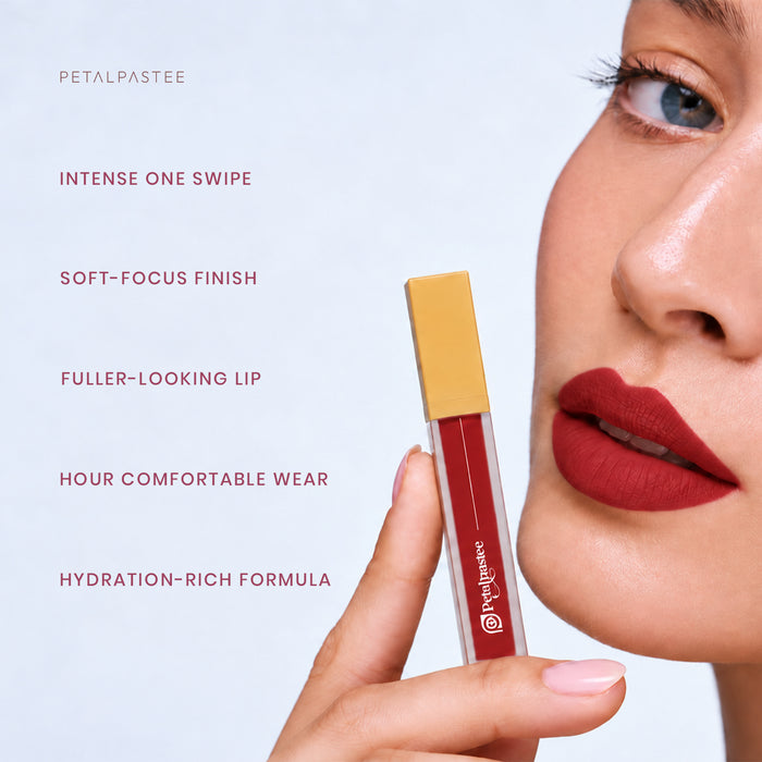 Model holding Crimson Luxe Cherry Luxe: intense one swipe, soft-focus finish, fuller-looking lip, comfortable wear, hydration-rich formula