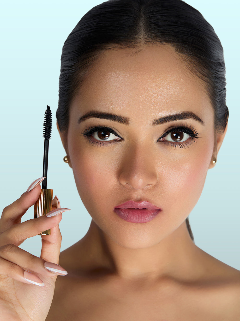 Wink It mascara creating ultra black lifted lashes on model